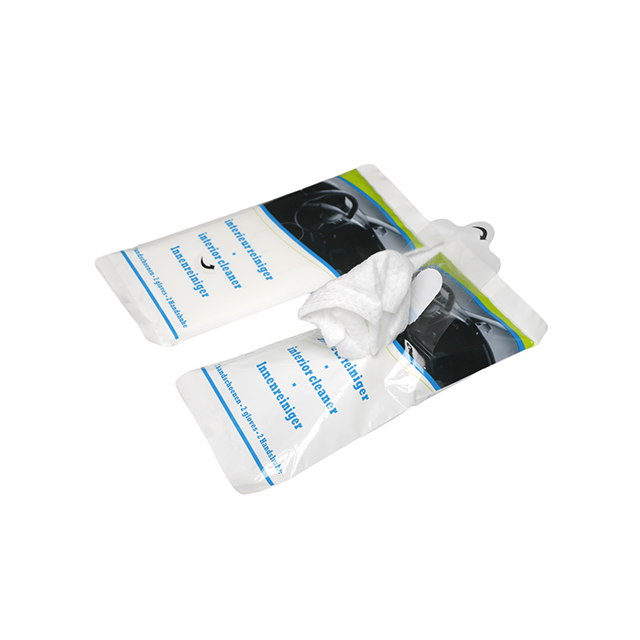 Car interior cleaning wipe usage on dashboard