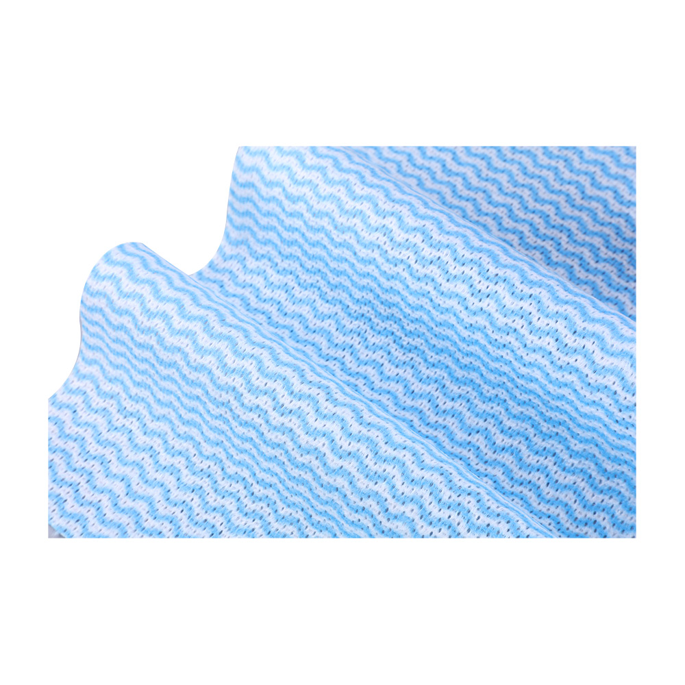 Industrial cleaning wipe lifting heavy machine grease from metal gears
